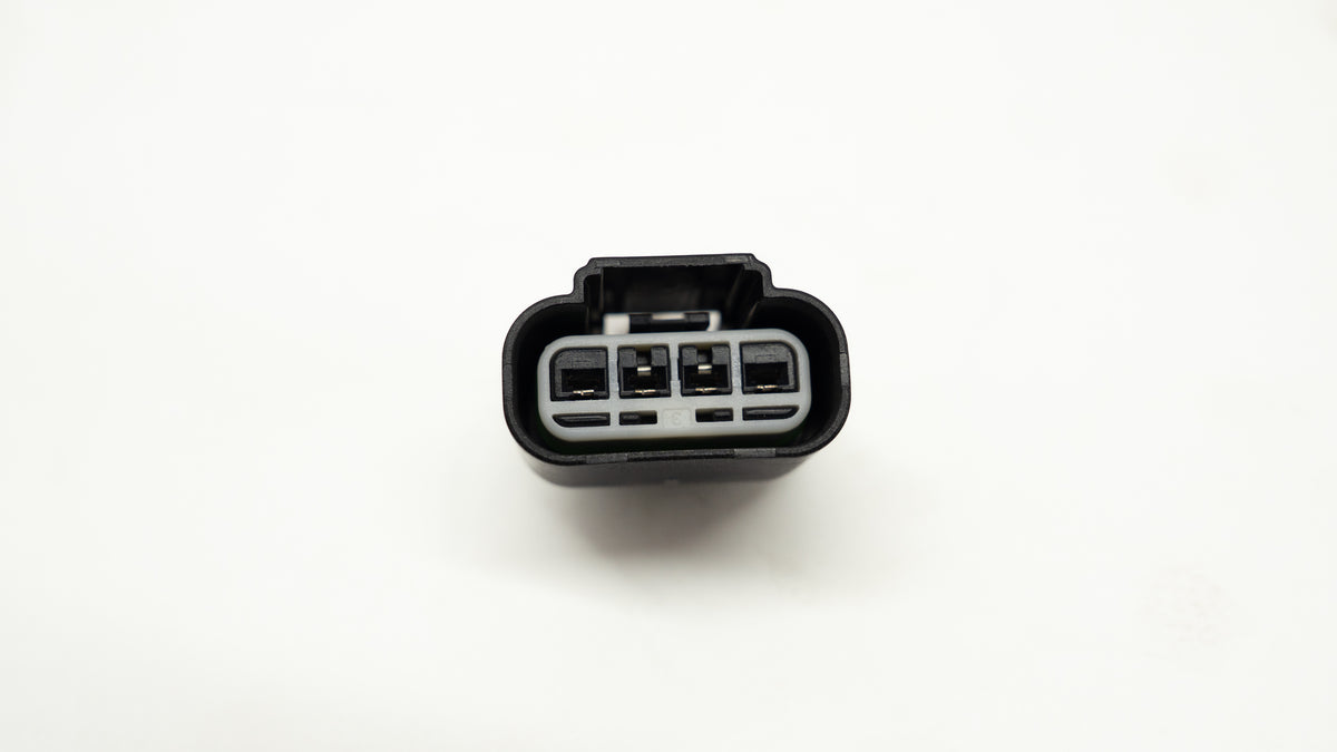 Automotive wiring connector on a white background