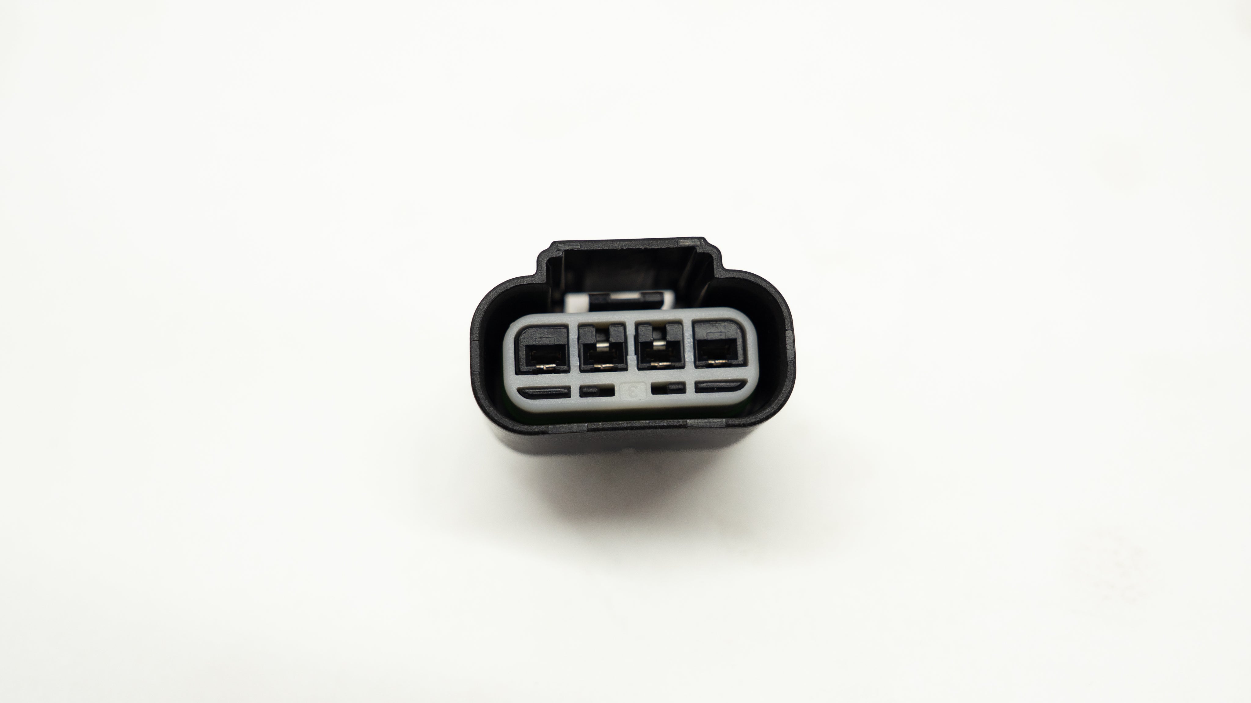 Automotive wiring connector on a white background