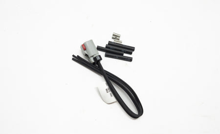 Set of electronic connectors and black wires on a white background