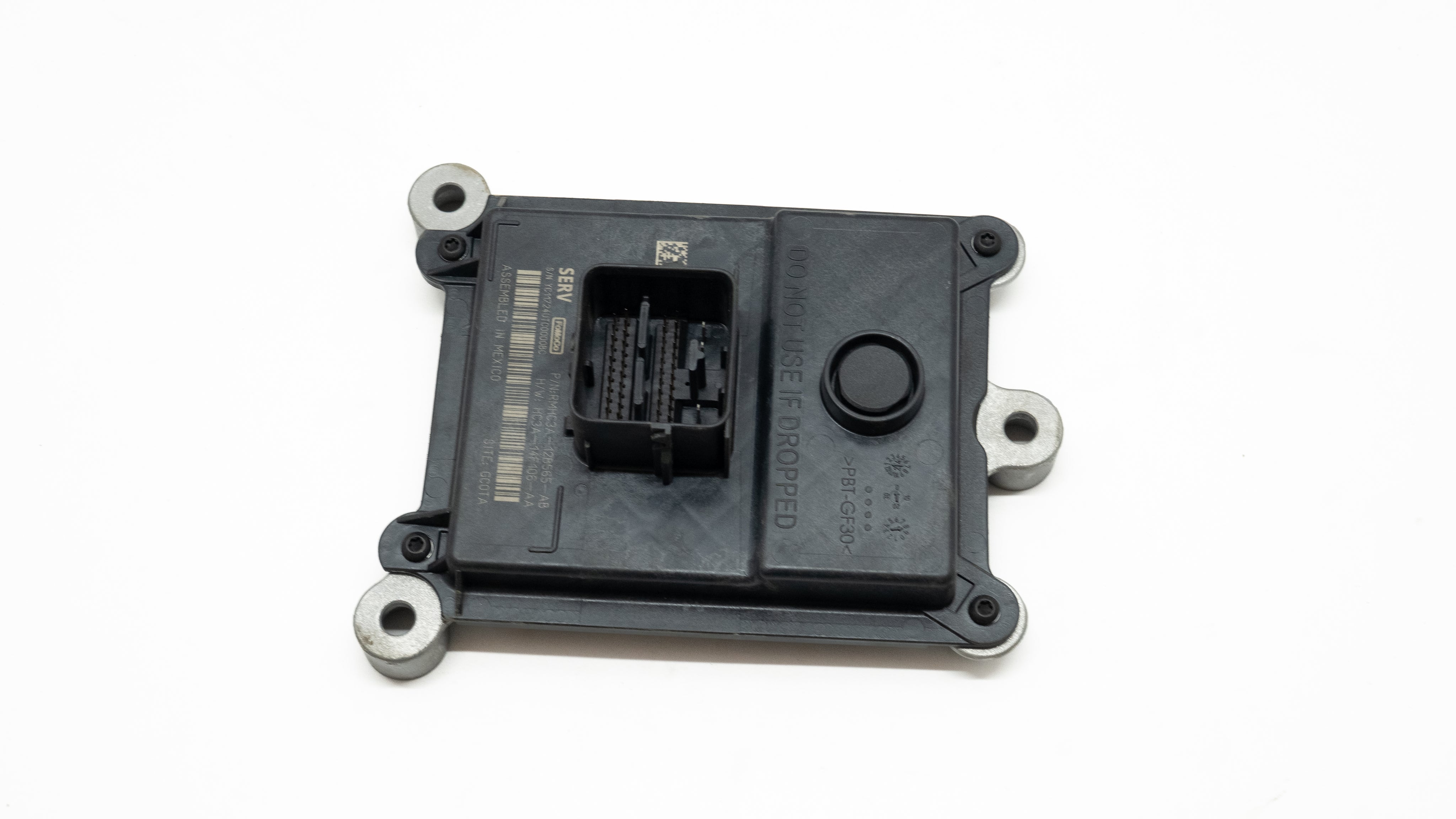 Square electronic transmission control component on a white background