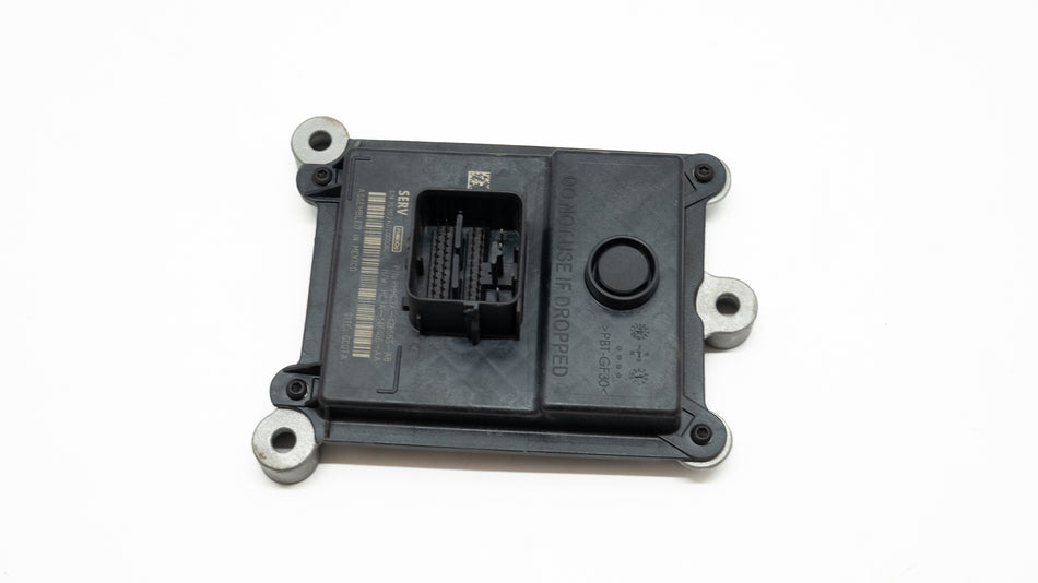 Square electronic transmission control component on a white background