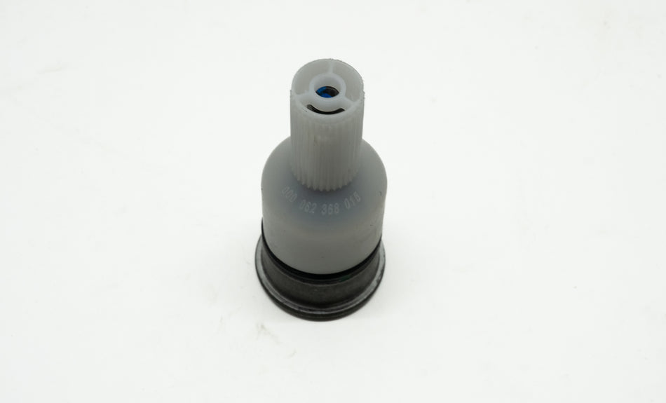 Automotive ball joint assembly with plastic cover on white background. 