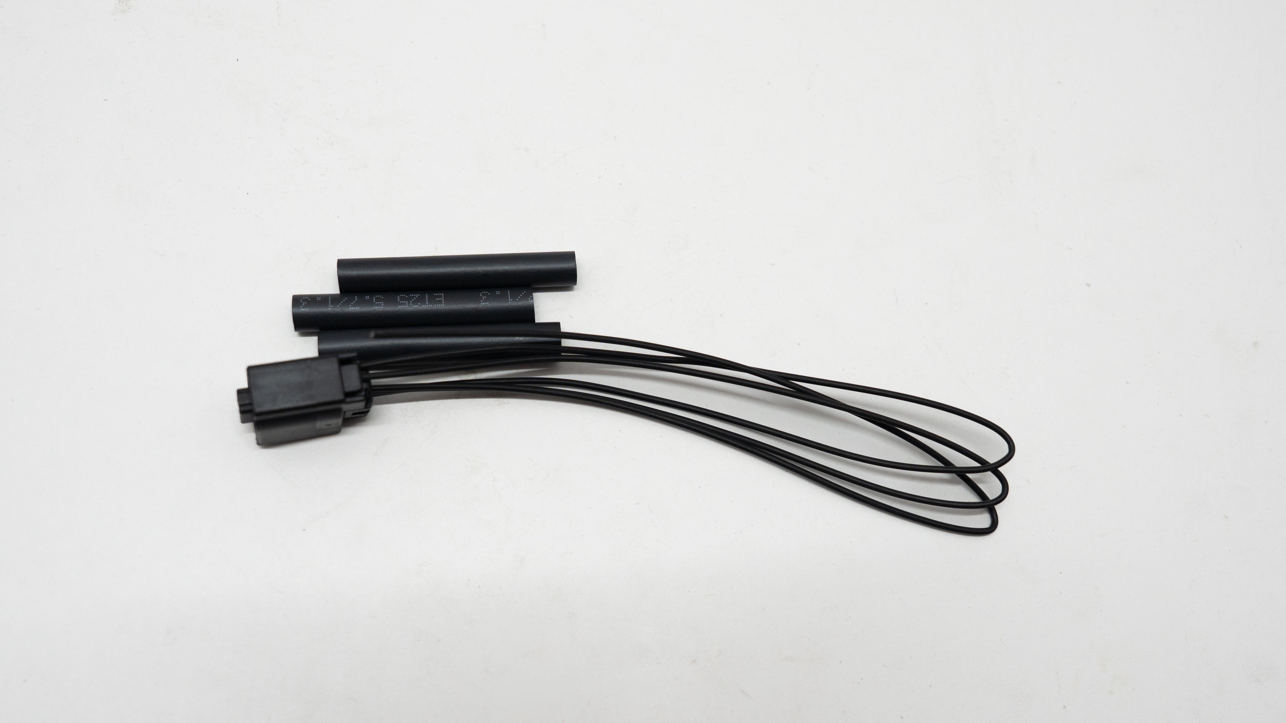 Black electronic components on a white background