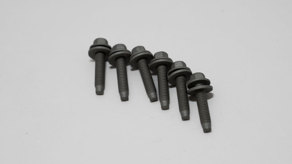 Set of black automotive screws with washer on a gray background.