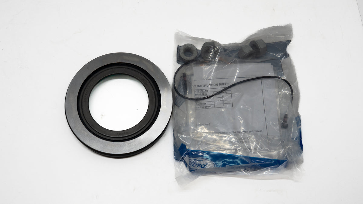 Automotive metal circular seal and kit components in packaging on white background. 