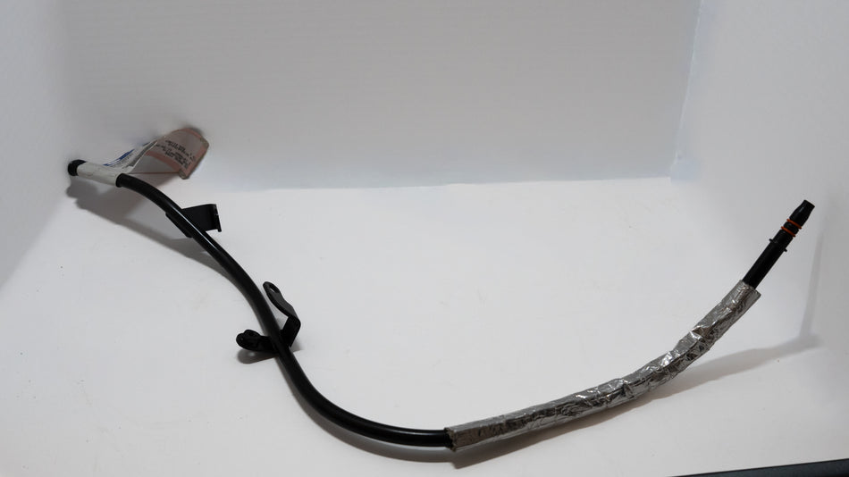 Black automotive oil dipstick tube on a white background. 