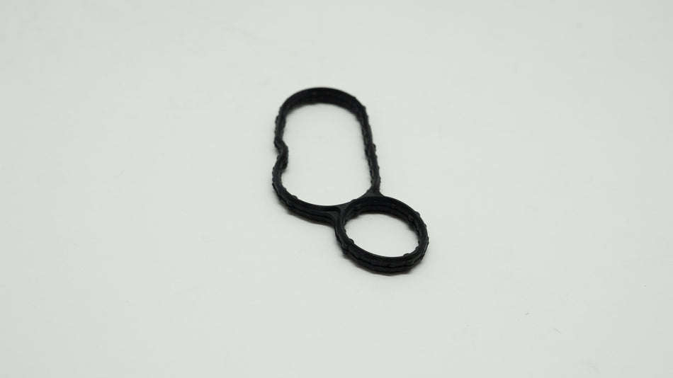 Black rubber gasket on a white background