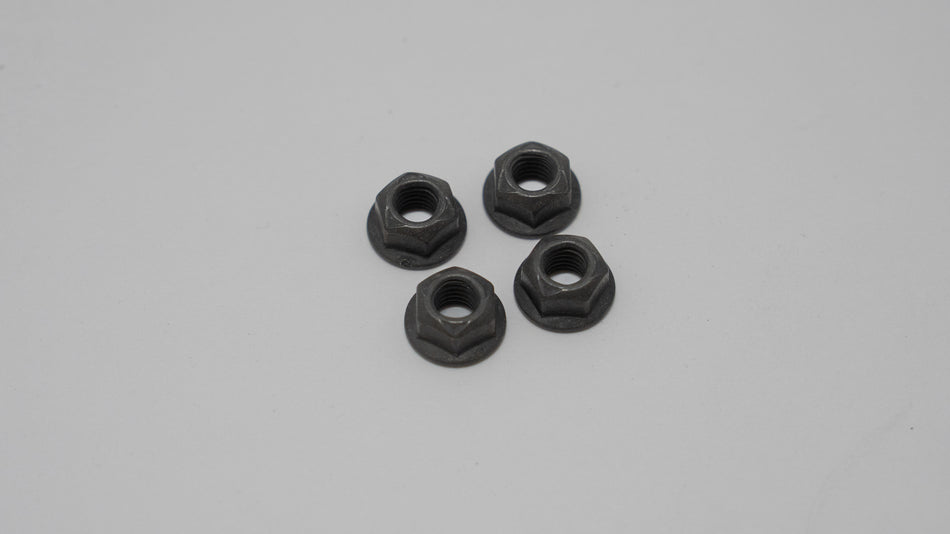 Four black hex nuts on a gray background
