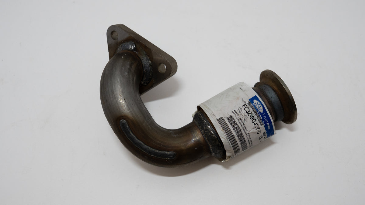 Metal pipe fitting for automotive exhaust with a Ford label on a white background