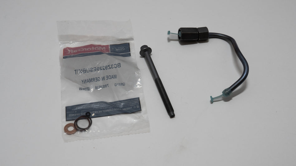 Automotive fuel injector kit including a black rod, black cable, and packaging on a white background