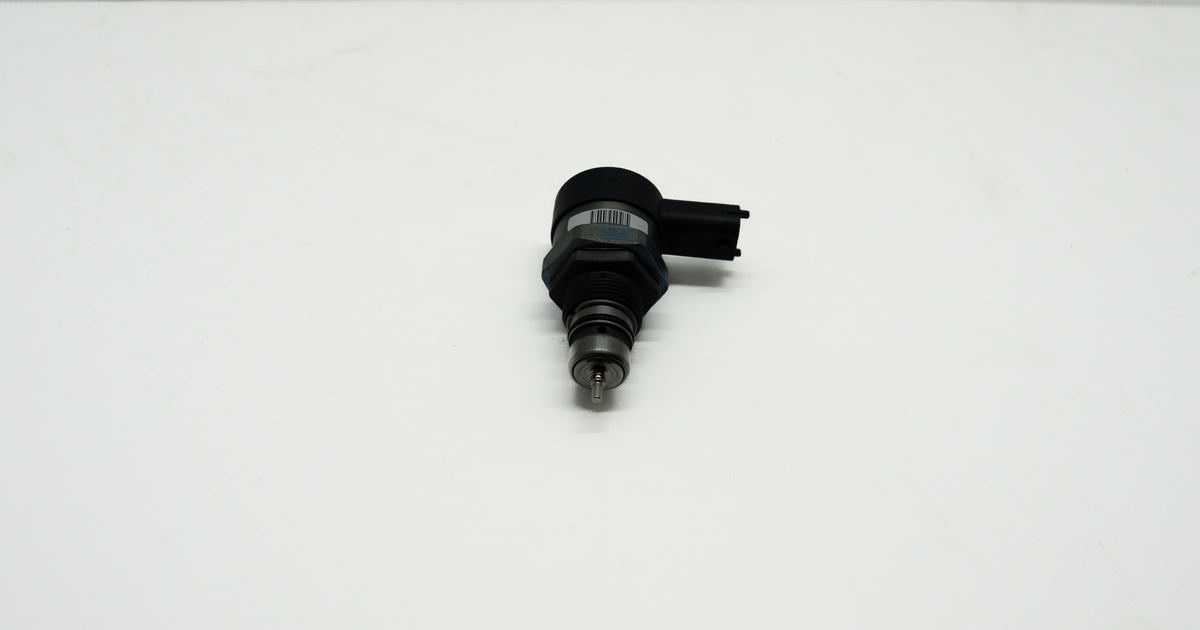 Black mechanical component on a white background