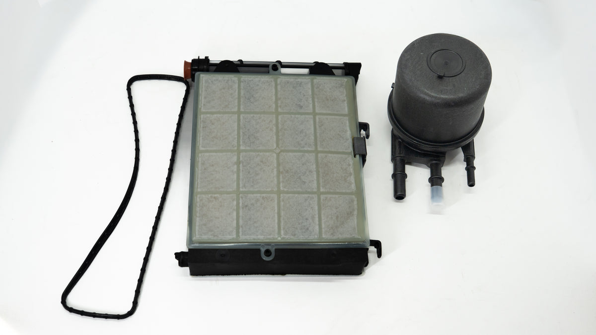 Auto Fuel Water Separator Filter and reservoir on a white background. 