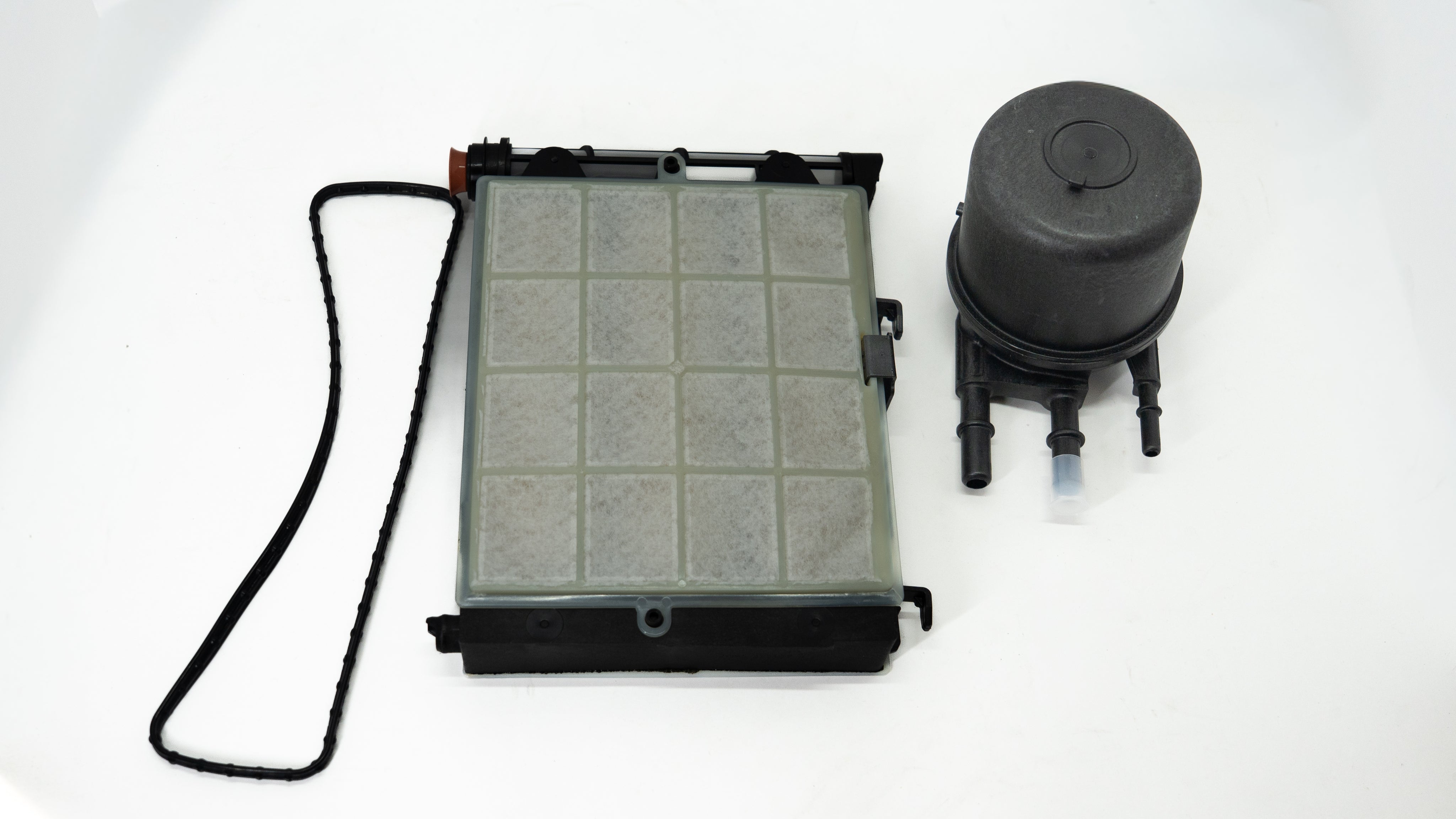 Auto Fuel Water Separator Filter and reservoir on a white background. 