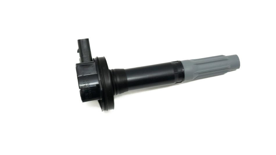 Black ignition coil on a white background