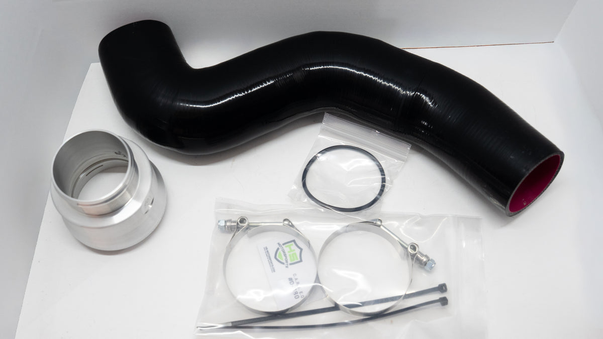 Black silicone automotive pipe with connector and clamps on a white background. 