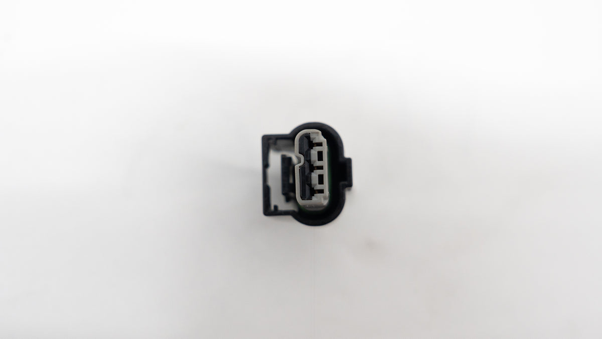 Black wire connector for auto on a white background