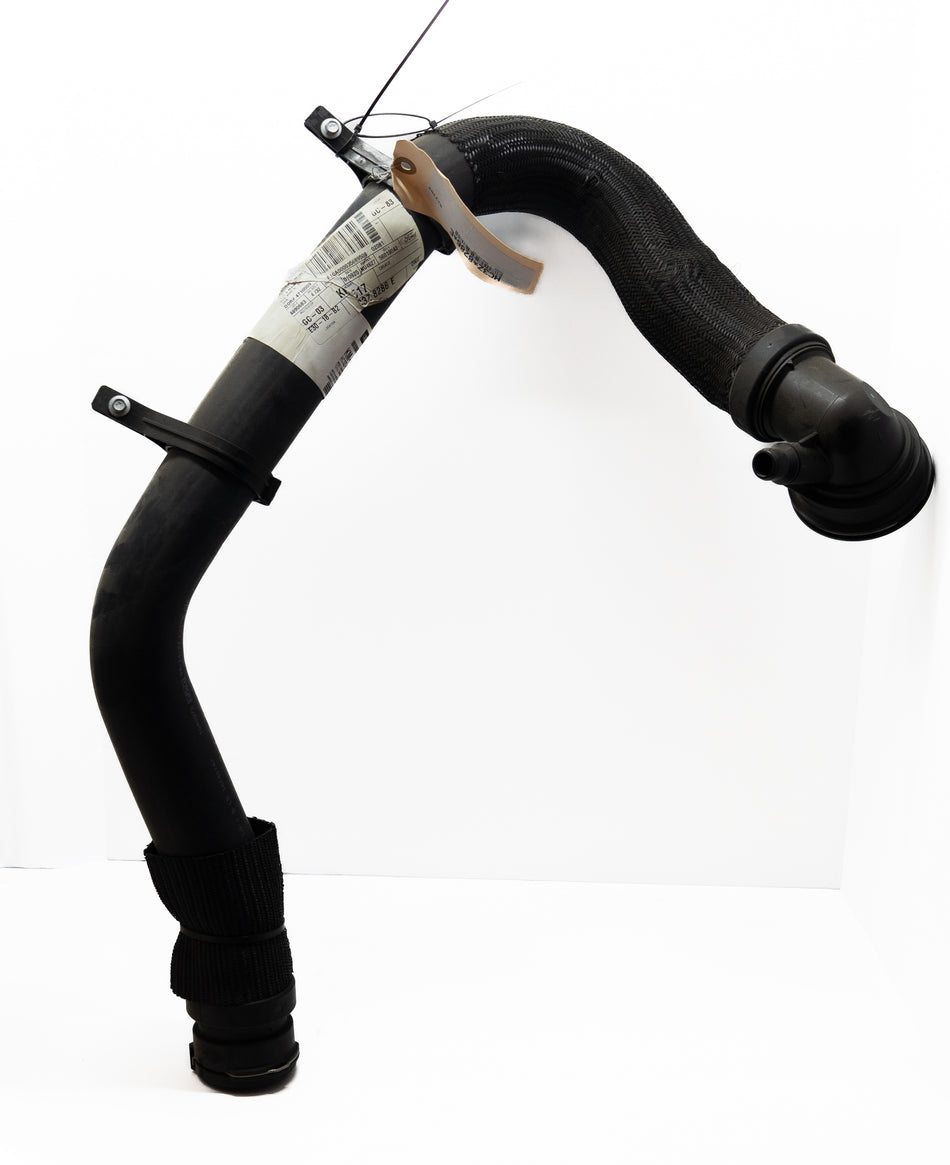 Black automotive hose with a label on a white background