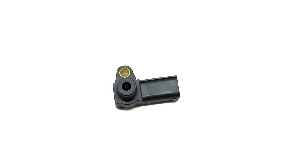 Black automotive sensor on a white background
