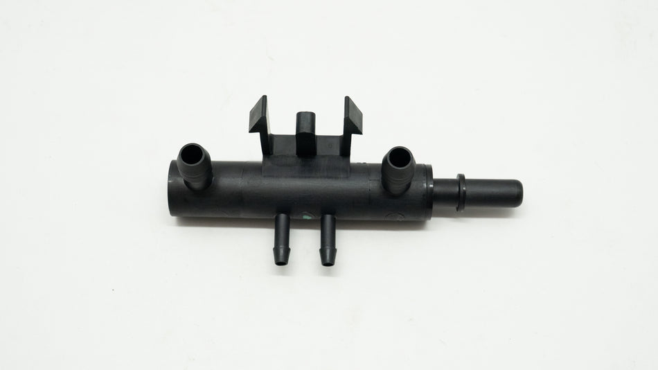 Black metal valve connector on a white background