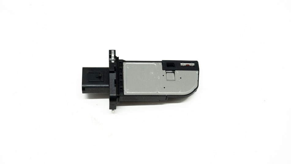 Black and silver automotive sensor on a white background