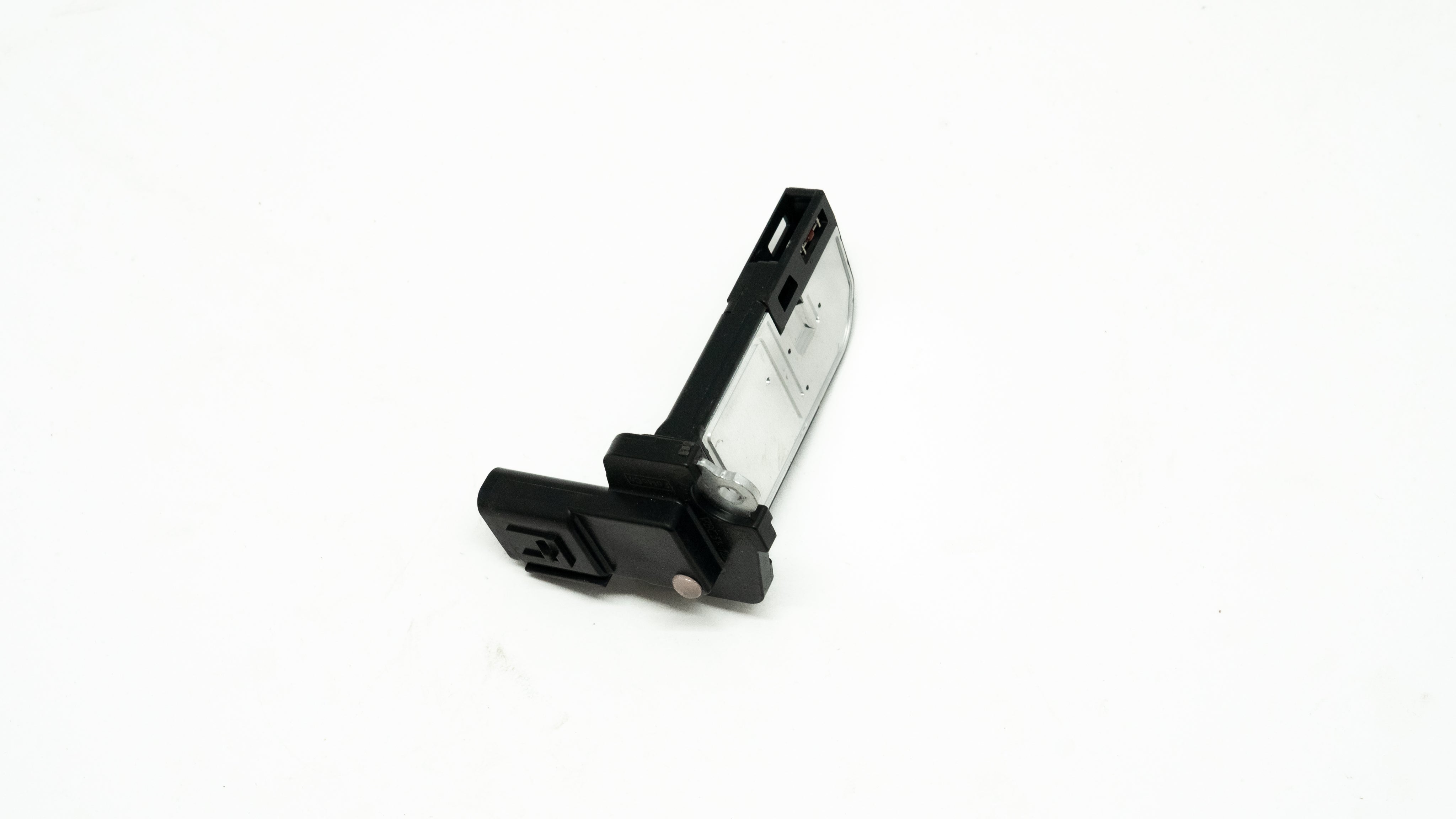 Black and silver rectangular automotive sensor on a white background