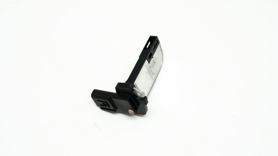 Black and silver rectangular automotive sensor on a white background