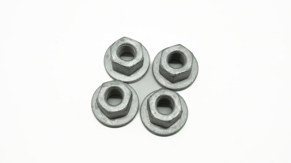 Four metal nuts on a white background