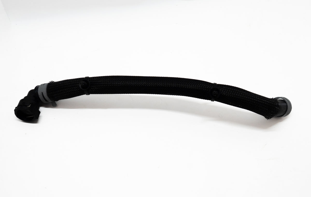 Black automotive hose with connectors on both ends on a white background.