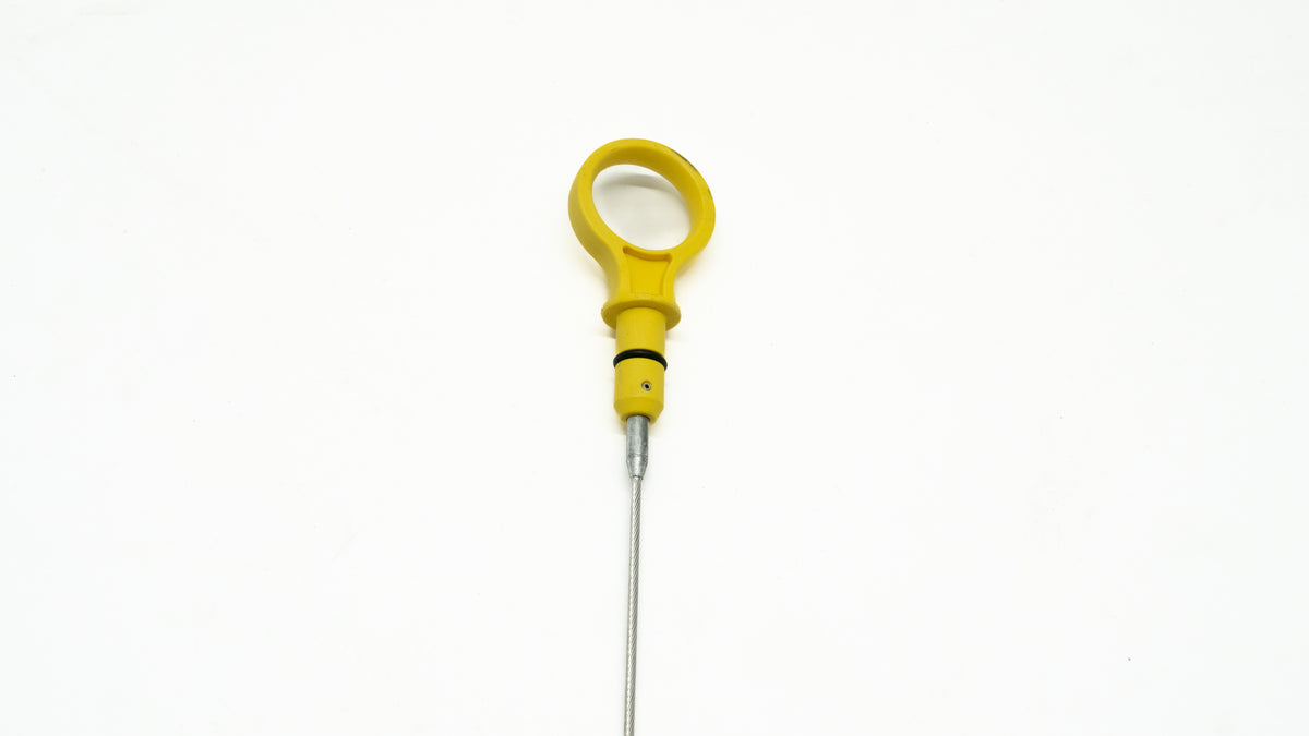 Yellow oil dipstick on a white background