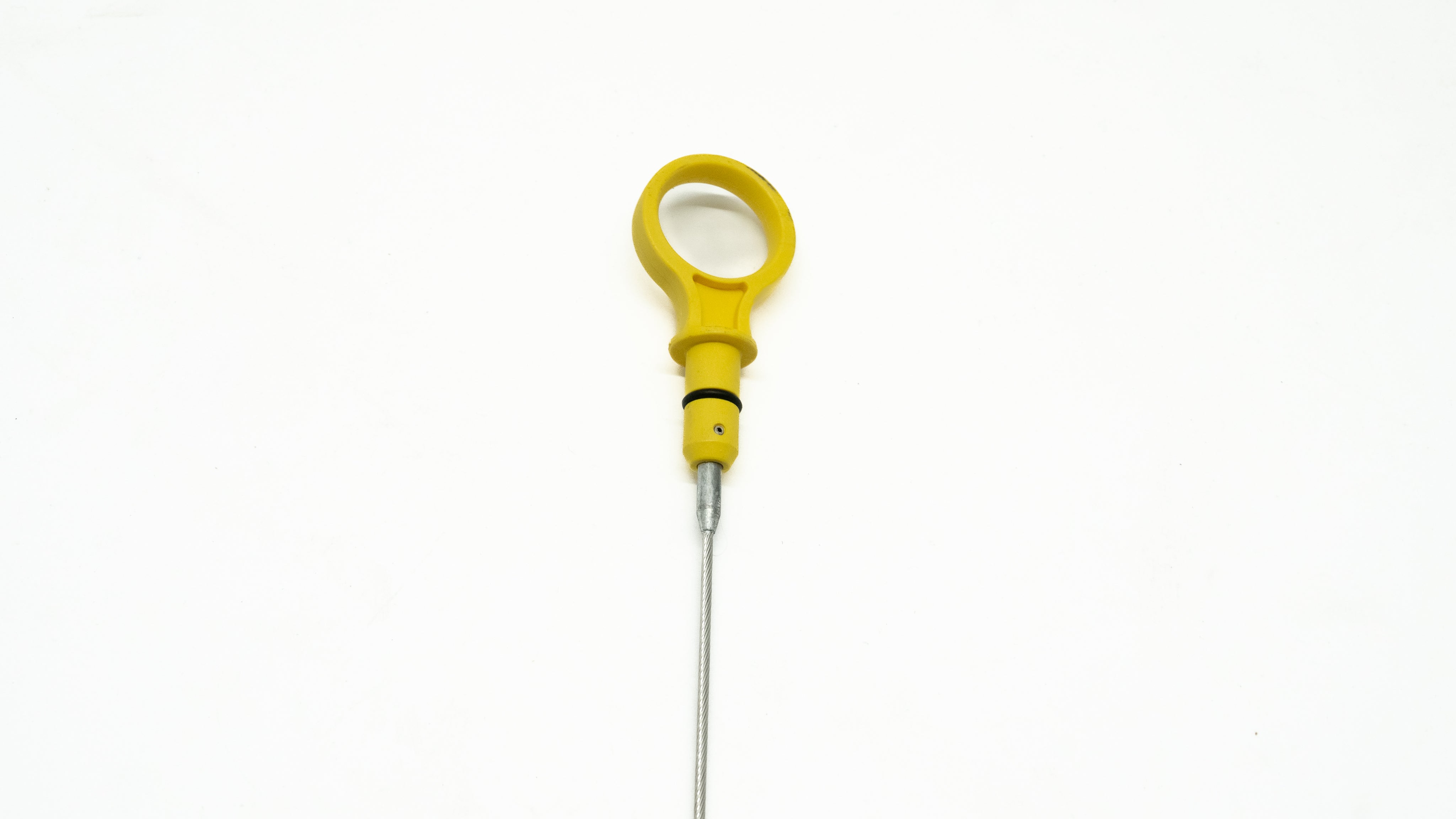 Yellow oil dipstick on a white background