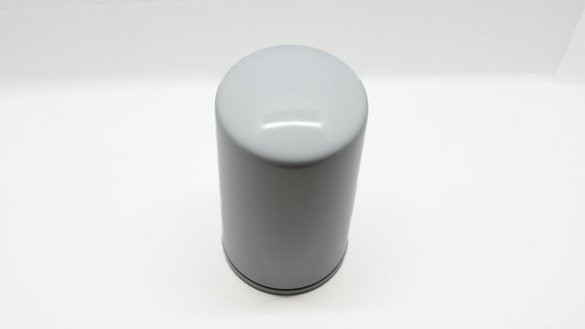 Gray cylindrical automotive oil filter on a white background