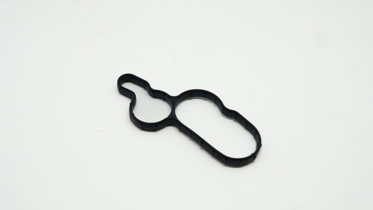 Black rubber gasket on a white background