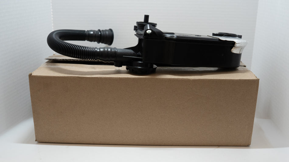 Black engine oil / air separator valve and hose on product box on a white background.  