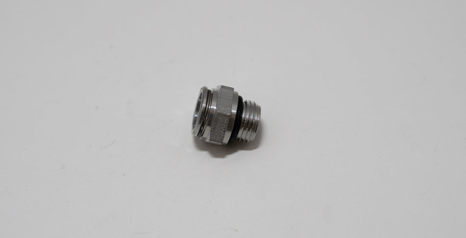 Automotive metal fitting on a white background