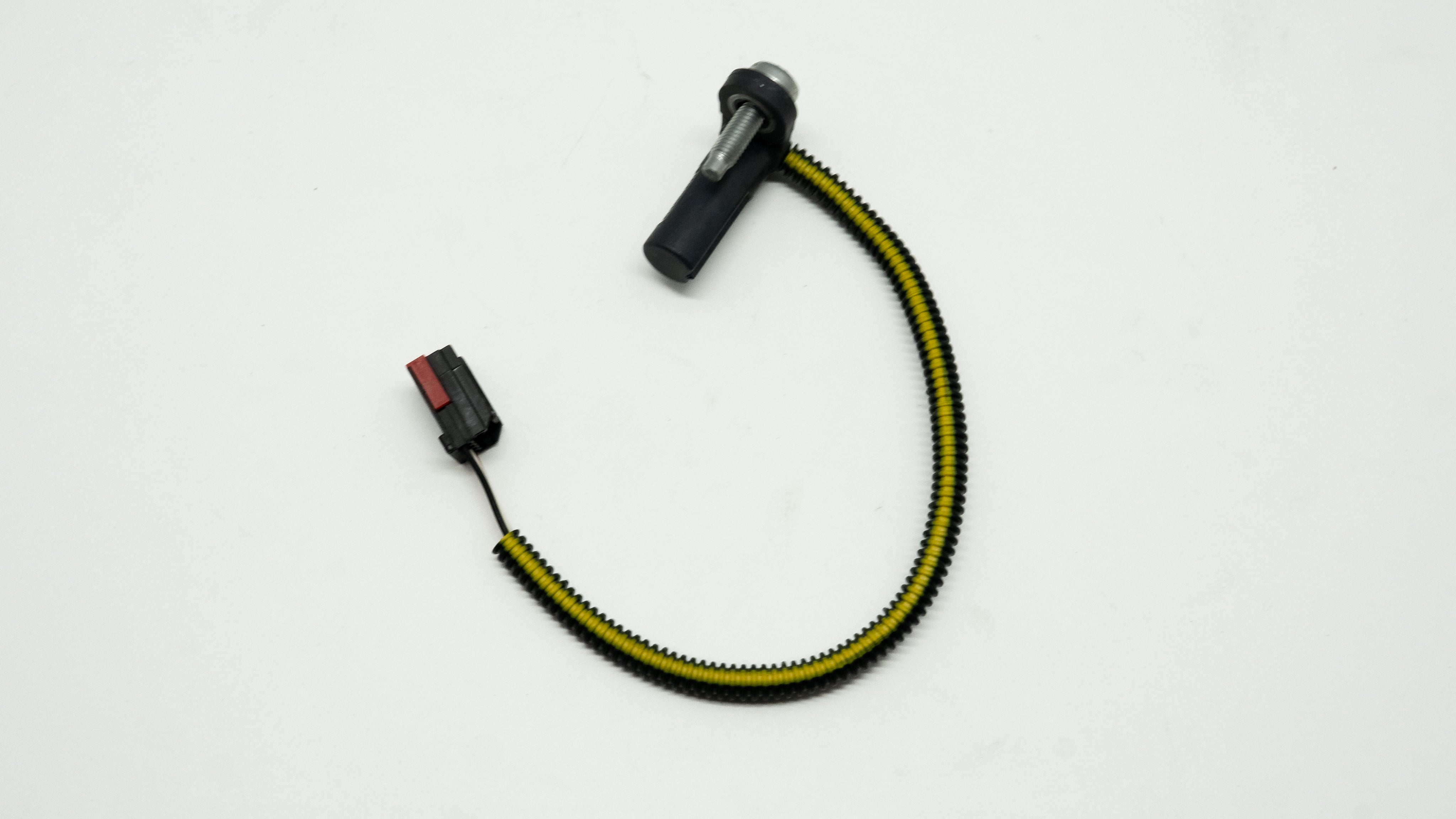 Yellow and black wiring cable with connectors on a white background