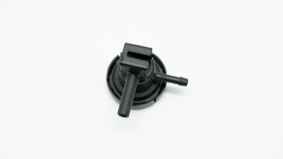 Black mechanical component on a white background