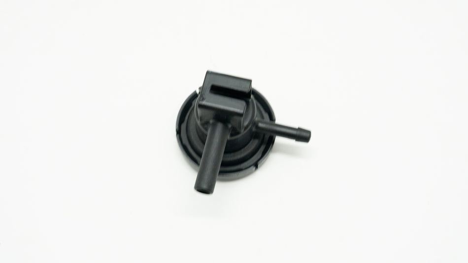 Black mechanical component on a white background