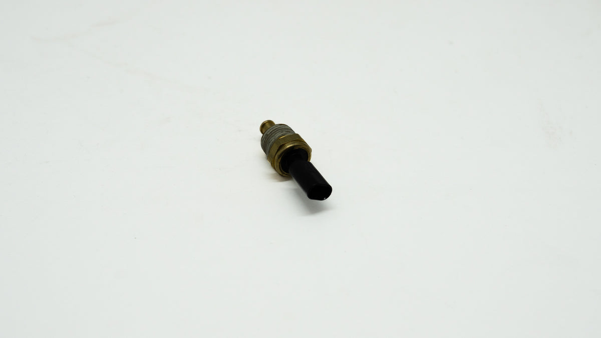 Small cylindrical metal component on a white background