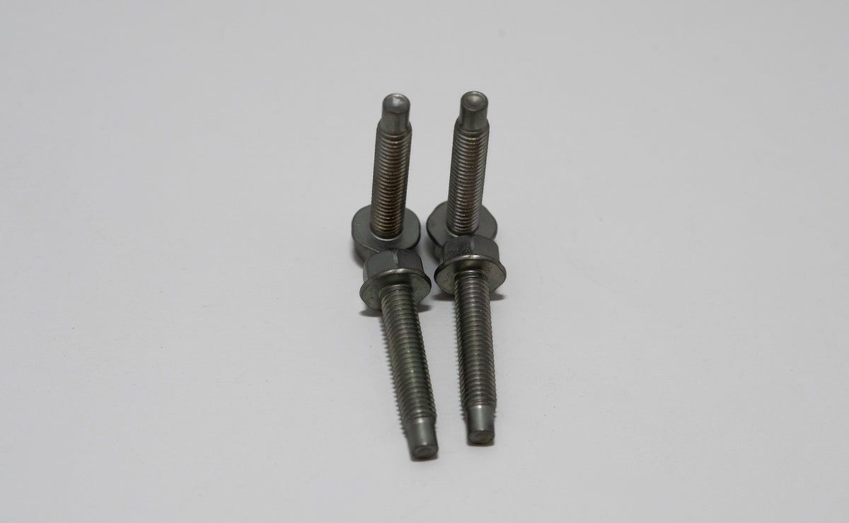 Two metal automotive screws on a gray background