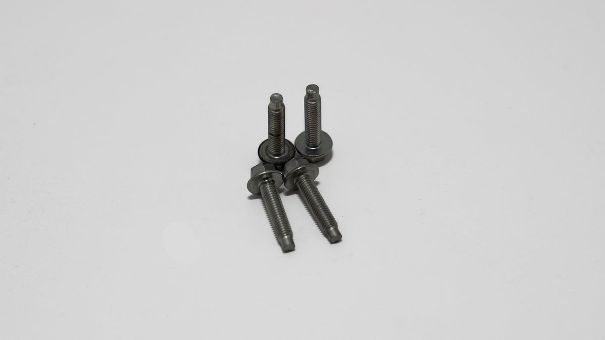 Four automotive tie down bolts, with hex screw head on white background.