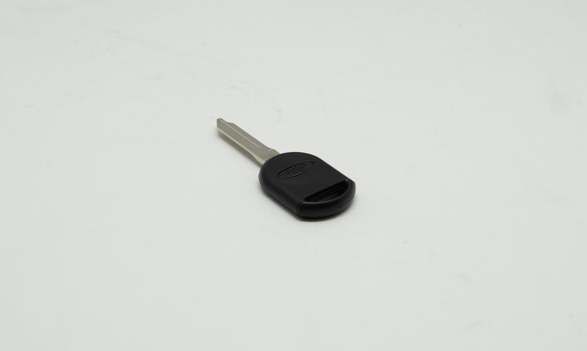 Black and metal car key on white background. 