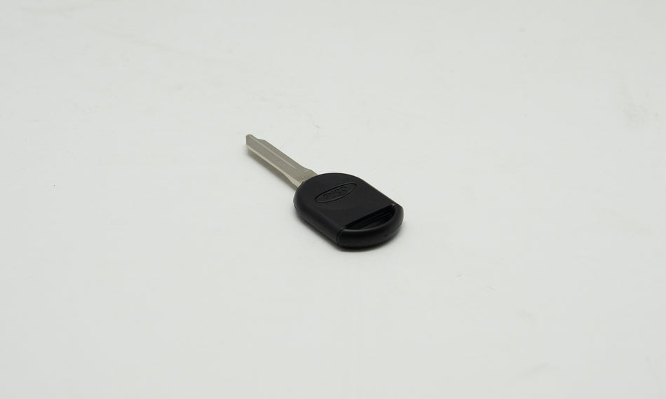 Black and metal car key on white background. 