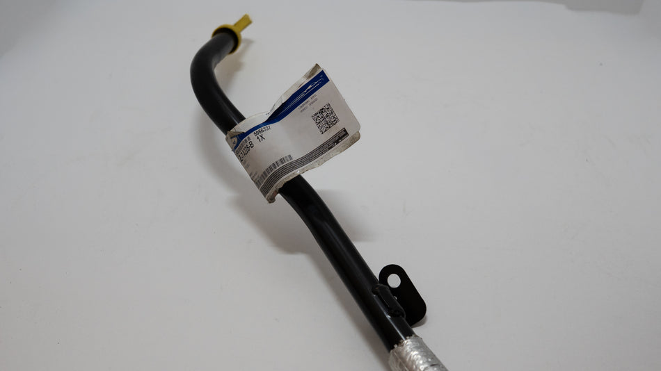 Black metal hose with a label on a white background