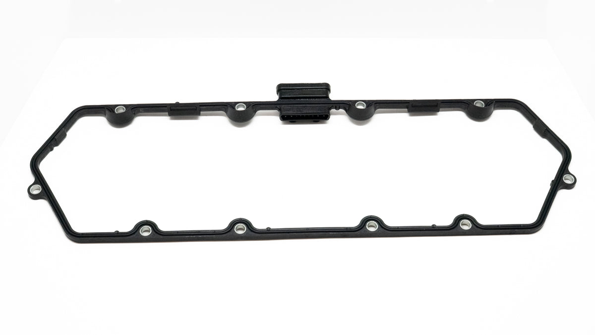 Black oil pan gasket on a white background