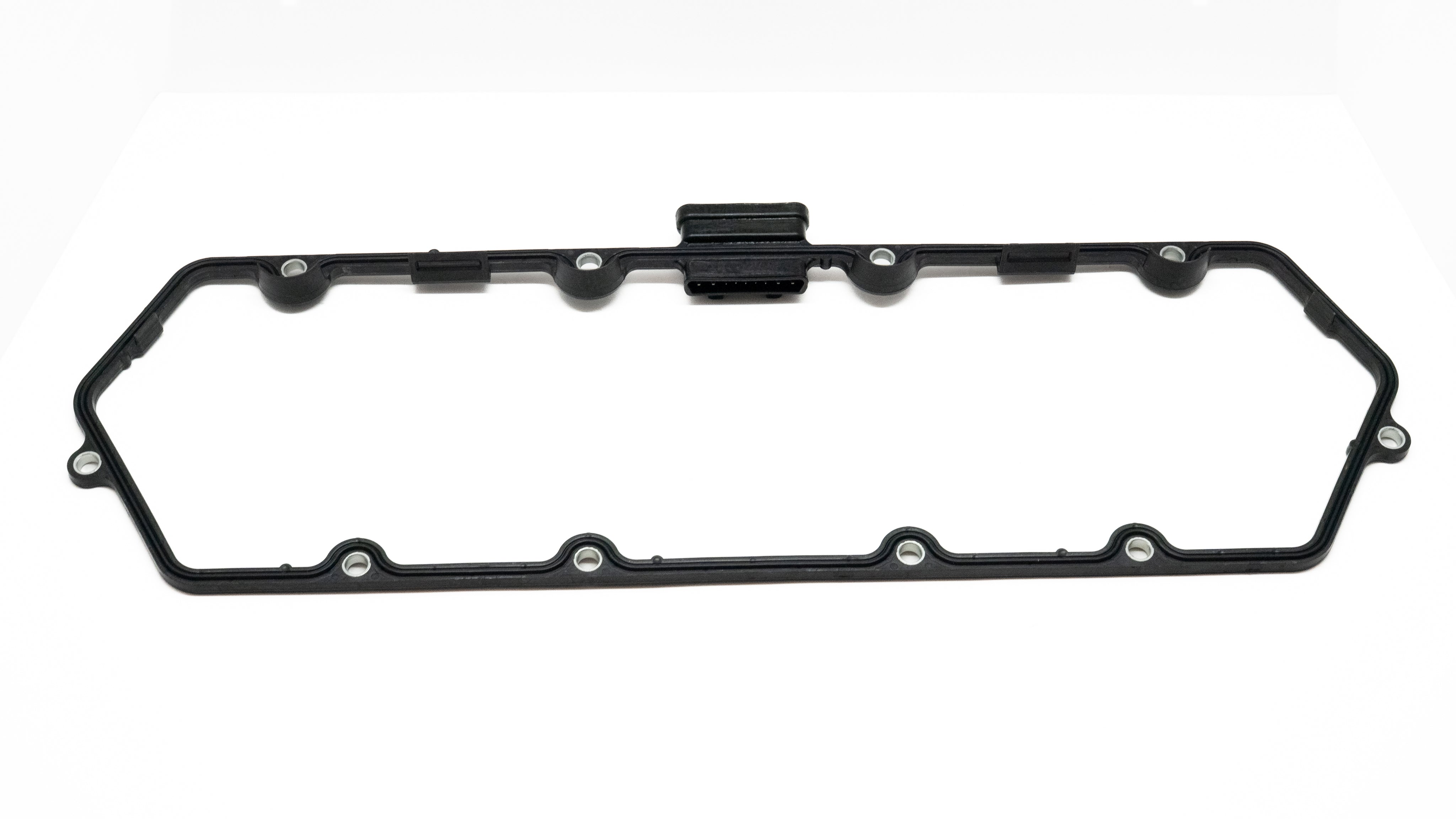 Black oil pan gasket on a white background