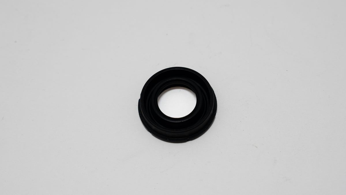 Black rubber automotive gasket on a gray background