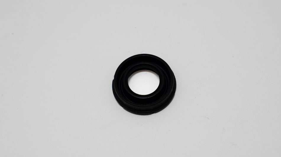 Black rubber automotive gasket on a gray background
