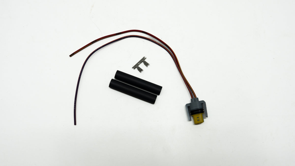 Electrical components including wires and connectors on a white background