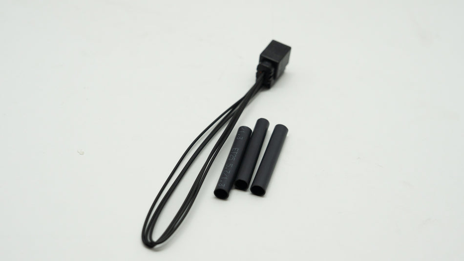 Black wiring kit with three black connectors on a white background