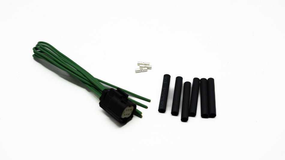Green ignition cable set with connectors on a white background